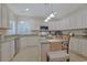 Bright kitchen featuring granite countertops, white cabinetry, and stainless steel appliances at 428 Arlington Circle, Murrells Inlet, SC 29576