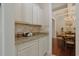 Butlers pantry with granite counters, tile backsplash, and decorative cabinets at 428 Arlington Circle, Murrells Inlet, SC 29576