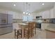 Well-lit kitchen with granite countertops, stainless steel appliances, and a functional center island at 428 Arlington Circle, Murrells Inlet, SC 29576