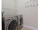 Bright laundry room features high efficiency washer and dryer at 428 Arlington Circle, Murrells Inlet, SC 29576