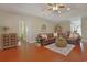 Open-concept living room with hardwood floors, stylish decor, and an inviting seating arrangement at 428 Arlington Circle, Murrells Inlet, SC 29576
