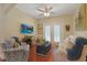 Cozy living room with a ceiling fan, hardwood floors, and French doors to the exterior at 428 Arlington Circle, Murrells Inlet, SC 29576