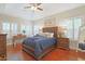 Spacious main bedroom with hardwood floors, tray ceilings, and natural light at 428 Arlington Circle, Murrells Inlet, SC 29576