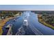 Expansive aerial view of the waterway with boats and beautiful tree lined waterway at 4325 Ellis Ave., Little River, SC 29566
