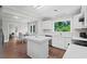 Updated kitchen with stainless steel appliances, white cabinets, and central island at 4325 Ellis Ave., Little River, SC 29566