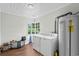This laundry room has a washer, dryer, water heater, and window for natural light at 4325 Ellis Ave., Little River, SC 29566