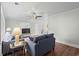 Cozy living room featuring hardwood floors, paneled ceilings, and comfortable seating arrangement at 4325 Ellis Ave., Little River, SC 29566