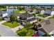 Aerial view of home with solar panels, showcasing its backyard, neighborhood, and nearby pond at 445 Mooreland Dr., Myrtle Beach, SC 29588