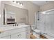 Bathroom featuring white vanity, shower, and a decorative mirror with access to bedroom at 445 Mooreland Dr., Myrtle Beach, SC 29588