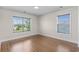 This bedroom offers wood floors and two windows to bring in plenty of natural light at 445 Mooreland Dr., Myrtle Beach, SC 29588