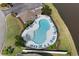 Aerial view of the neighborhood pool surrounded by lounge chairs and lush landscaping at 445 Mooreland Dr., Myrtle Beach, SC 29588