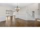 Spacious dining room with hardwood floors, wainscoting, and an elegant chandelier at 445 Mooreland Dr., Myrtle Beach, SC 29588