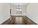 Formal dining room with hardwood floors, wainscoting, and a large window providing natural light at 445 Mooreland Dr., Myrtle Beach, SC 29588