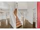 Elegant two-story foyer with hardwood floors, a staircase, and views into adjacent rooms at 445 Mooreland Dr., Myrtle Beach, SC 29588