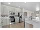 Modern kitchen with stainless appliances, tile backsplash, and countertops at 445 Mooreland Dr., Myrtle Beach, SC 29588