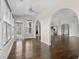 Bright living room features hardwood floors, neutral walls, arched doorway, and natural light at 445 Mooreland Dr., Myrtle Beach, SC 29588
