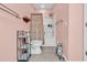 Well-lit bathroom with a toilet and combination shower and tub at 447 Mahogany Dr. # 102, Murrells Inlet, SC 29576