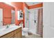 Bathroom featuring a walk-in shower and single sink vanity offering a clean and functional space at 447 Mahogany Dr. # 102, Murrells Inlet, SC 29576