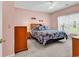 A peaceful bedroom with carpet, light-colored walls, and plenty of natural light at 447 Mahogany Dr. # 102, Murrells Inlet, SC 29576