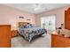 A spacious bedroom featuring carpeted floors, an overhead fan, and ample natural light at 447 Mahogany Dr. # 102, Murrells Inlet, SC 29576