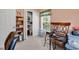 Bedroom featuring a closet, window with blinds and bookcase shelves for storage at 447 Mahogany Dr. # 102, Murrells Inlet, SC 29576