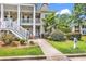 Charming condo featuring a covered porch, well-maintained landscaping, and accessible entrance at 447 Mahogany Dr. # 102, Murrells Inlet, SC 29576