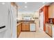 Bright kitchen featuring granite countertops, wood cabinets and modern appliances at 447 Mahogany Dr. # 102, Murrells Inlet, SC 29576