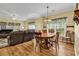 Inviting living room features laminate floors and a large leather sofa at 447 Mahogany Dr. # 102, Murrells Inlet, SC 29576