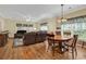 Bright living room and dining area featuring hardwood floors, ceiling fan and natural light at 447 Mahogany Dr. # 102, Murrells Inlet, SC 29576