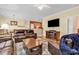 Spacious living room with open layout and an entertainment center at 447 Mahogany Dr. # 102, Murrells Inlet, SC 29576