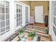Cozy back patio with a striped rug, outdoor furniture, and views at 447 Mahogany Dr. # 102, Murrells Inlet, SC 29576