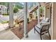 Relaxing covered porch with comfortable seating and view of well-maintained landscaping at 447 Mahogany Dr. # 102, Murrells Inlet, SC 29576
