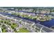 Aerial view showcases the property's location on the waterway, surrounded by homes, businesses, and lush greenery at 4518 N Plantation Dr. # G-5, Little River, SC 29566