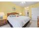 Bright bedroom featuring a comfortable king-sized bed, natural light, and decorative accents at 4518 N Plantation Dr. # G-5, Little River, SC 29566