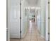 Entry hallway with doors, white trim and neutral tile at 4518 N Plantation Dr. # G-5, Little River, SC 29566