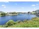 Beautiful view of the waterway surrounded by homes and lush greenery under a clear blue sky at 4518 N Plantation Dr. # G-5, Little River, SC 29566