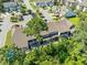 Aerial view of townhomes with manicured green spaces, tree coverage, and community parking at 468 Papyrus Circle # 468, Little River, SC 29566