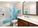 Clean bathroom featuring a sink, mirror, toilet and shower/tub combo with blue accents at 468 Papyrus Circle # 468, Little River, SC 29566