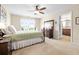 Bedroom with a bed, ceiling fan, hardwood furniture, large window and neutral walls at 468 Papyrus Circle # 468, Little River, SC 29566