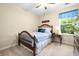 Charming bedroom with a wood bed frame, ceiling fan and bright window with plenty of natural light at 468 Papyrus Circle # 468, Little River, SC 29566