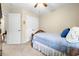 Bright bedroom with a wooden bed frame, carpeted floors, ceiling fan and a double door closet at 468 Papyrus Circle # 468, Little River, SC 29566