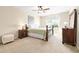 Bedroom with a ceiling fan, carpet flooring, neutral walls and two side tables at 468 Papyrus Circle # 468, Little River, SC 29566