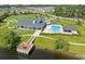 Community clubhouse featuring a pool, patio seating, and lake access at 468 Papyrus Circle # 468, Little River, SC 29566
