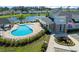 Aerial view of a community pool and clubhouse by a picturesque lake at 468 Papyrus Circle # 468, Little River, SC 29566