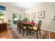 Elegant dining room with a traditional table set and access to outdoor space at 468 Papyrus Circle # 468, Little River, SC 29566