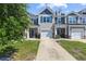 Charming townhome with stone accents, attached garage, and well-maintained landscaping at 468 Papyrus Circle # 468, Little River, SC 29566