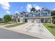 Well-maintained townhomes showcasing a blend of siding and stone accents, plus attached garages and landscaped lawns at 468 Papyrus Circle # 468, Little River, SC 29566