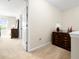 Upstairs hallway with carpet, side tables, and natural light from a window at 468 Papyrus Circle # 468, Little River, SC 29566