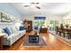 Open-concept living space with seamless flow from the living room to the dining area at 468 Papyrus Circle # 468, Little River, SC 29566
