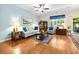 Bright living room with hardwood floors, ceiling fan, and ample natural light at 468 Papyrus Circle # 468, Little River, SC 29566